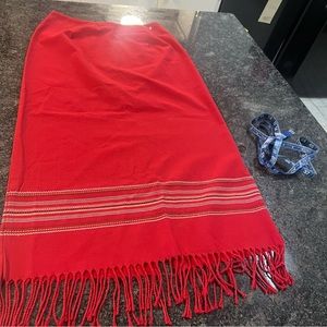 NWOT. Red Skirt with fringe. Slit in the back. Size 6.